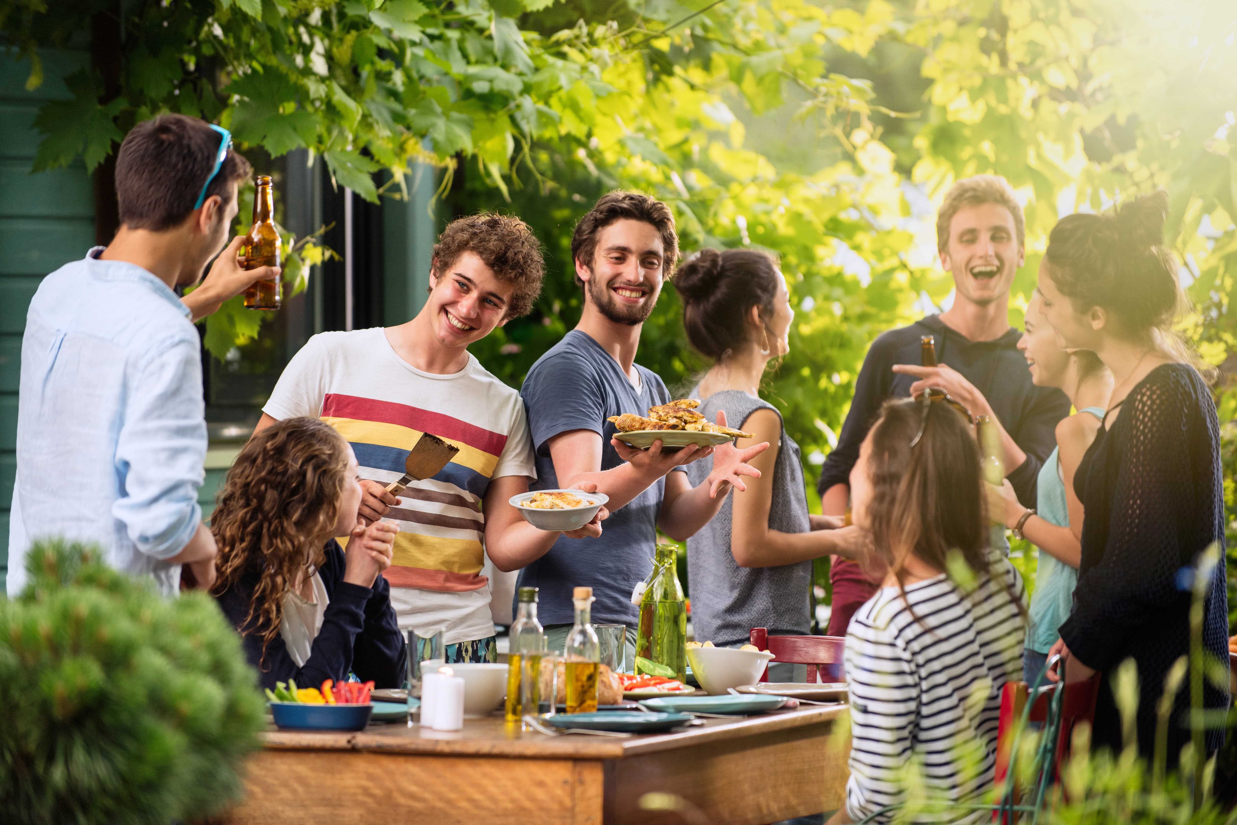 Group enjoying a party in their backyard Group enjoying a party in their backyard