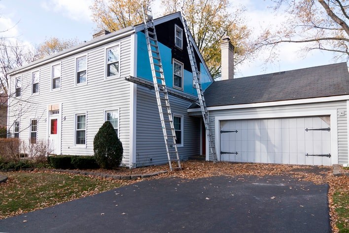 New vinyl siding installation on a family home New vinyl siding installation on a family home